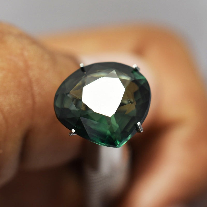 Deep Green Sapphire Pear Cut 7.80 Ct gemstone close up image