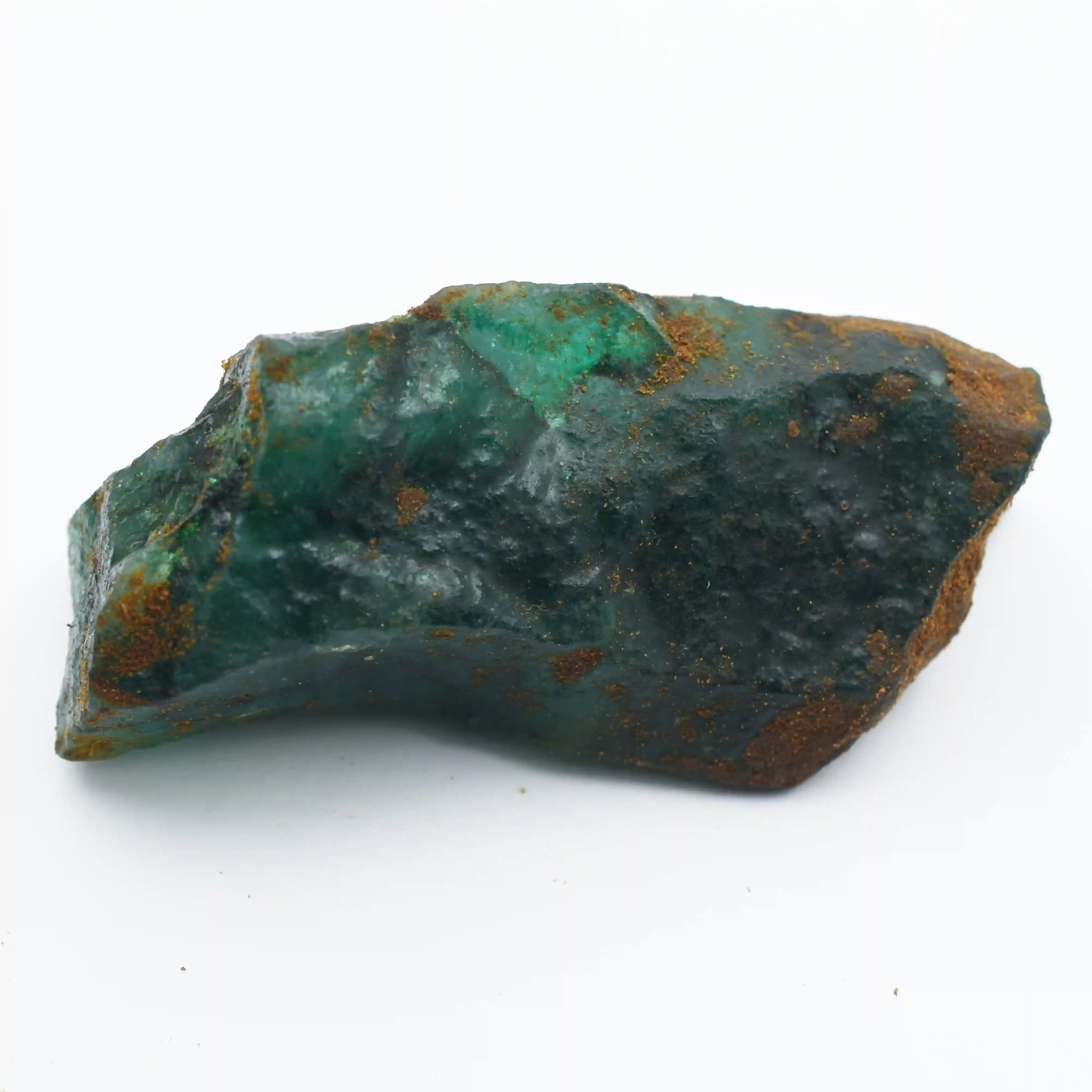 “Natural green gemstone chunk with internal luminosity and earthy surface details.”