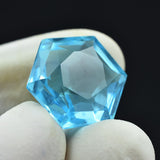 12.23 Ct Natural Aquamarine Octagon Gemstone Held in Fingers