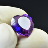 Brilliant-cut loose gemstone, natural purple sapphire.