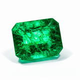price certified rare natural emerald 10.89 ct fine gemstone Faceted green gemstone on a white background