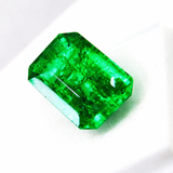 price certified rare natural emerald 10.89 ct fine gemstoneGreen gemstone on a white background