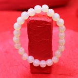 Pearl bracelet on a red background