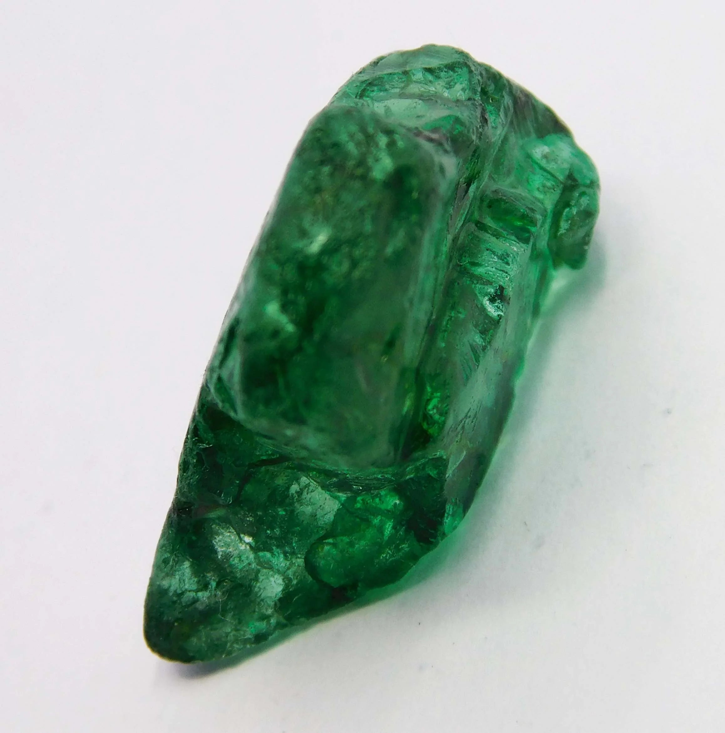 “Translucent green mineral chunk featuring rugged texture and natural inclusions.”