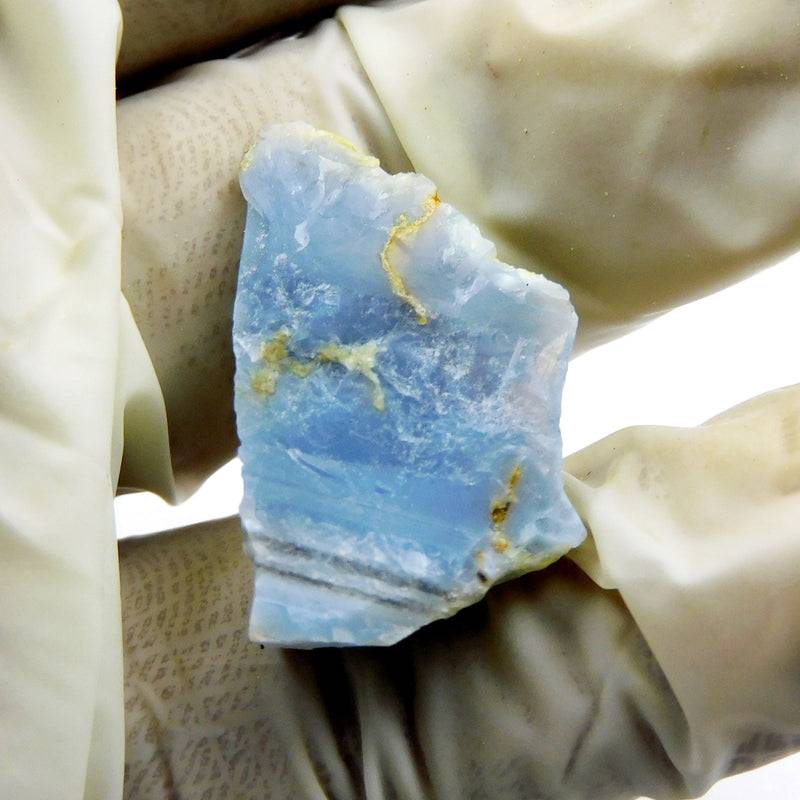 Blue Opal Rough 9.55 Carat raw blue opal on white background