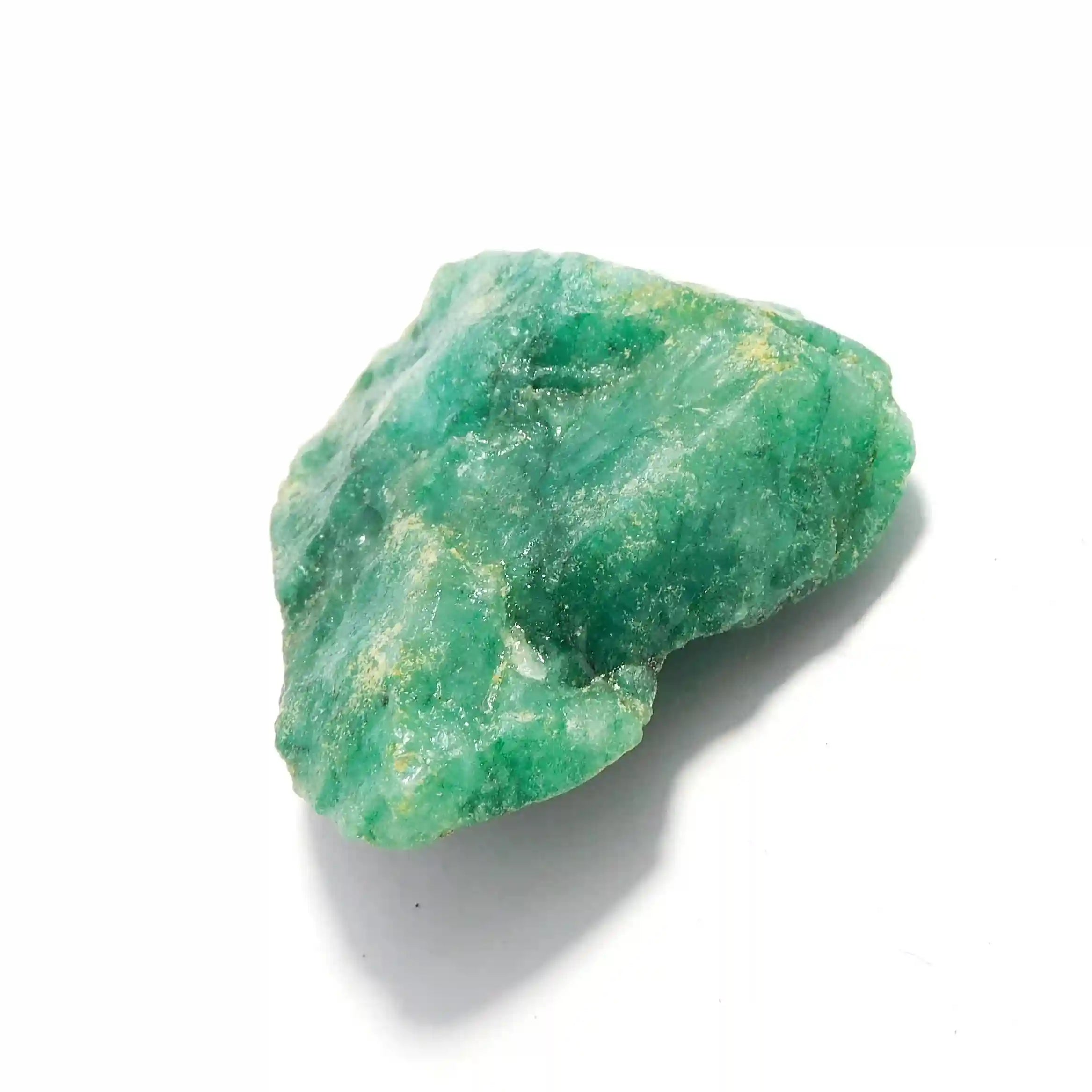 “Unpolished green beryl mineral chunk with irregular surface.”