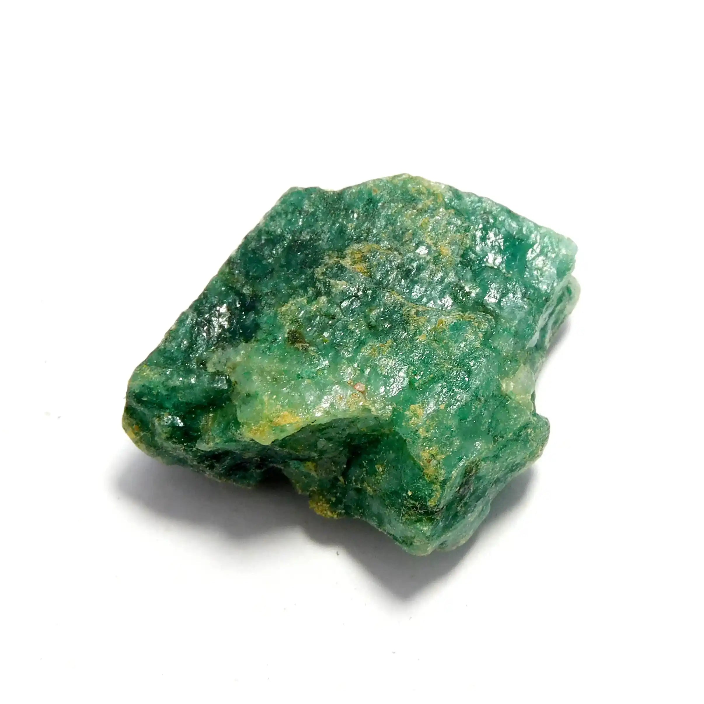 Untreated natural rough gem stone chunk with forest-green opaque tone and rugged mineral texture.