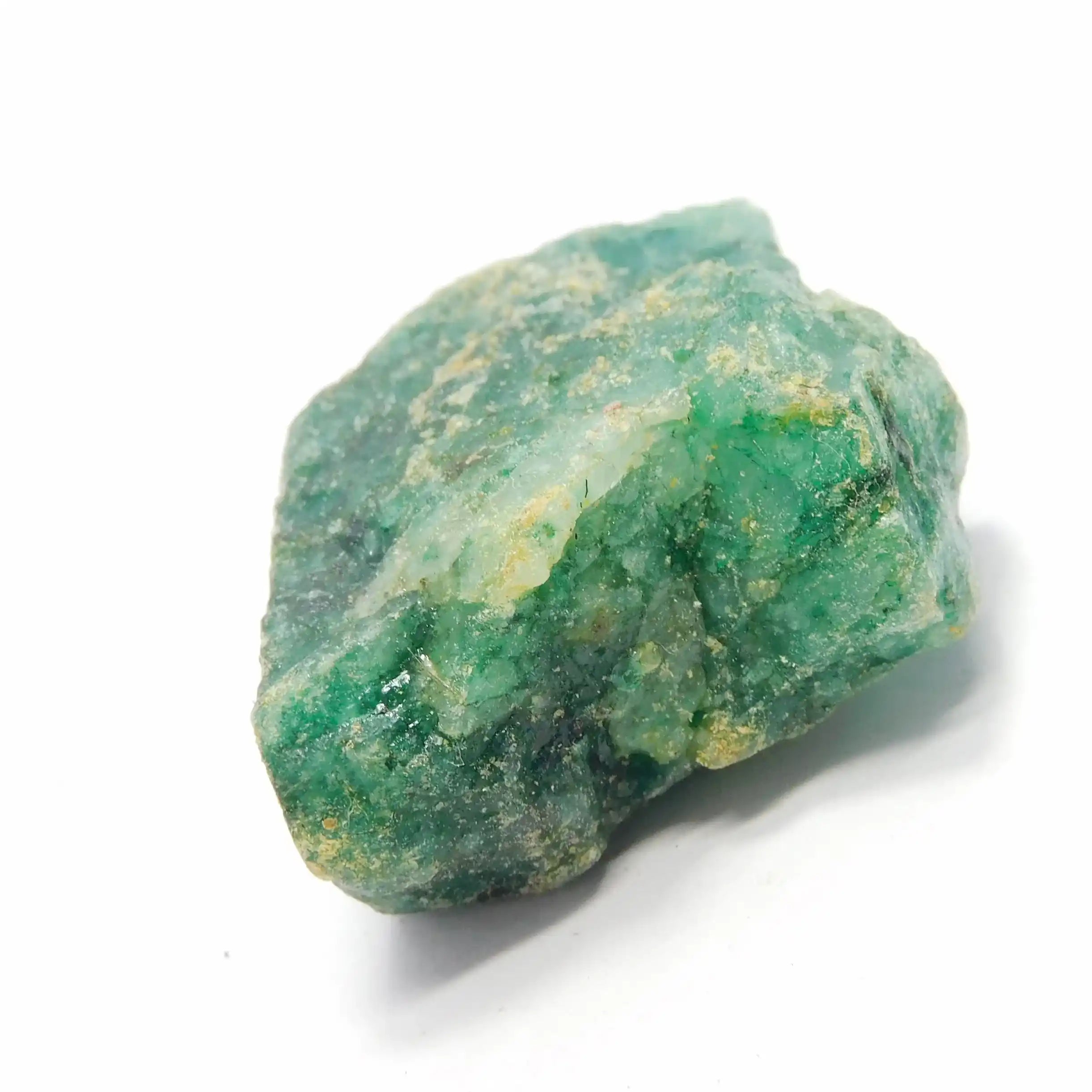 Raw opaque green gemstone rough showing natural crystal formation and earthy surface details.