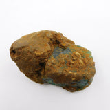 Brown mineral sample on a white background