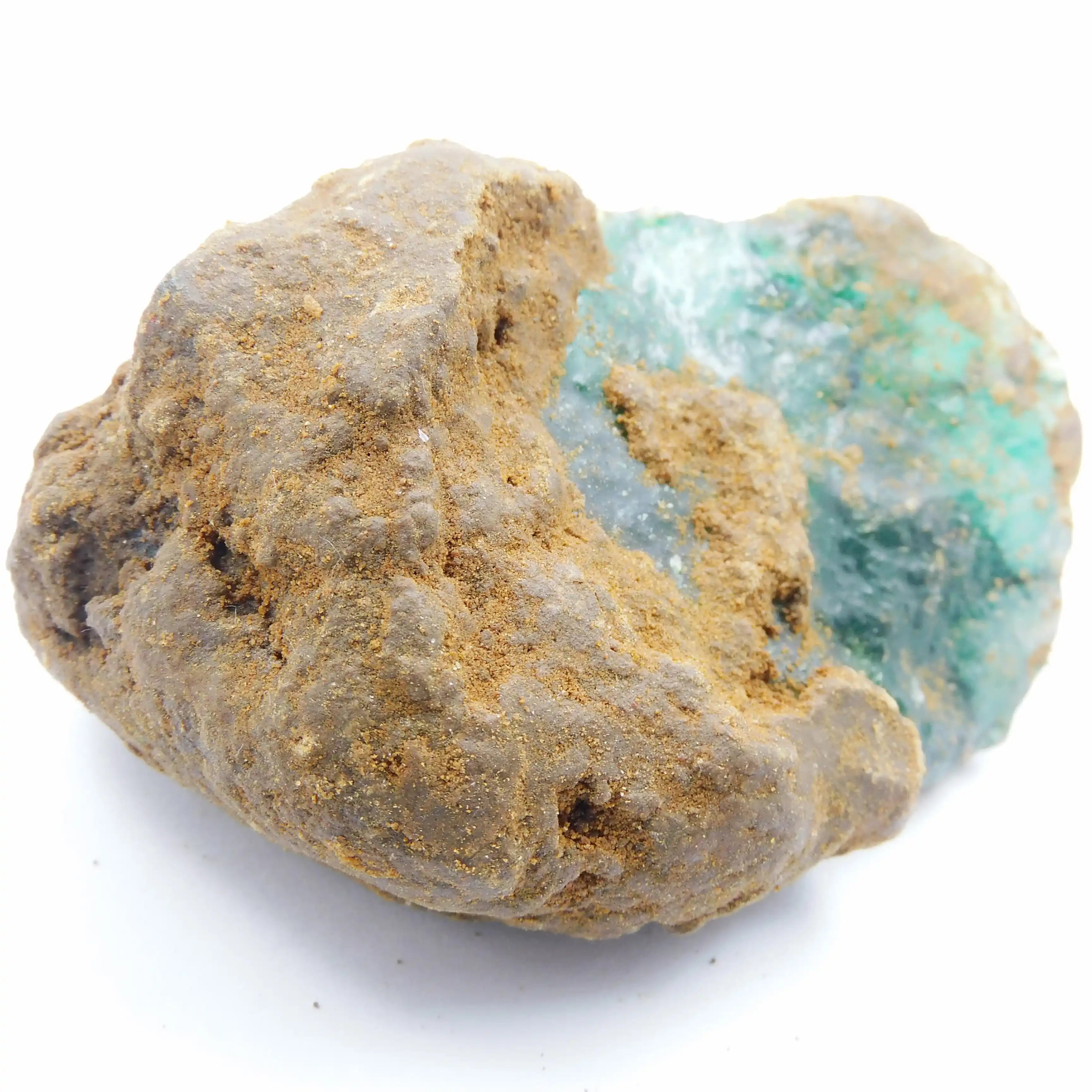 Mineral sample with a clear crystal inside on a white background