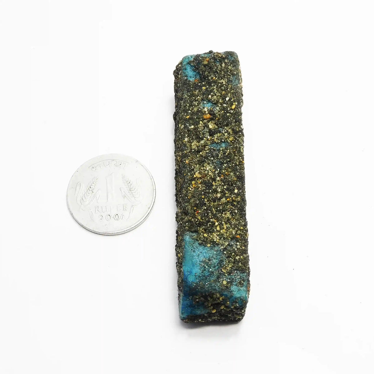 Mineral sample with blue and green colors next to a quarter for scale on a white background