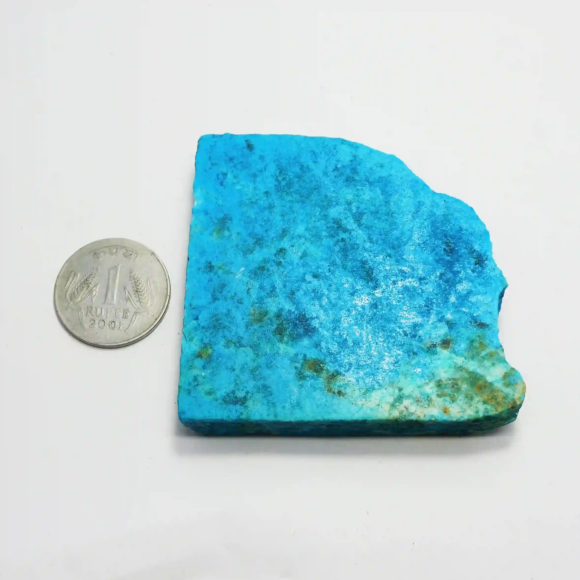 “Unpolished turquoise mineral piece with textured surface and natural matrix.”