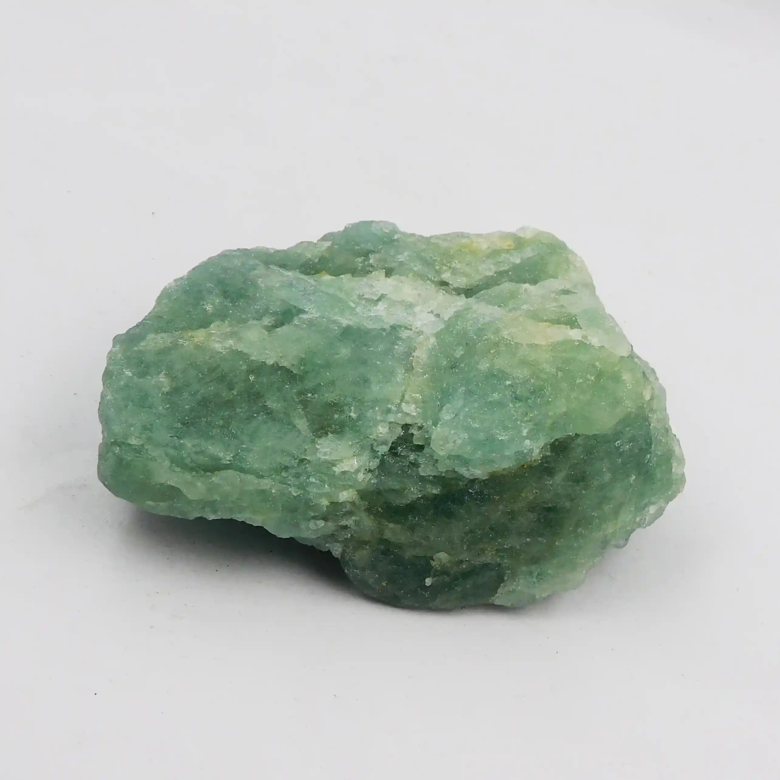 Green crystal rock on a white background