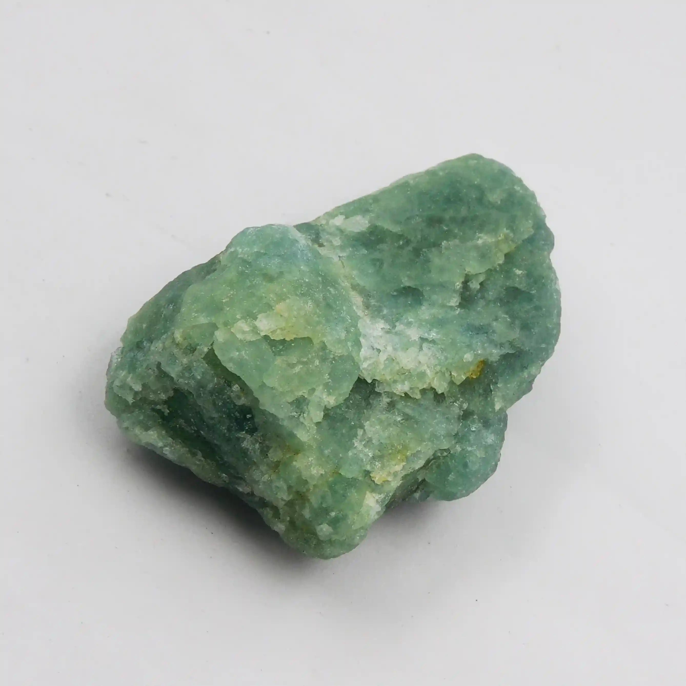 Green mineral rock on a white background