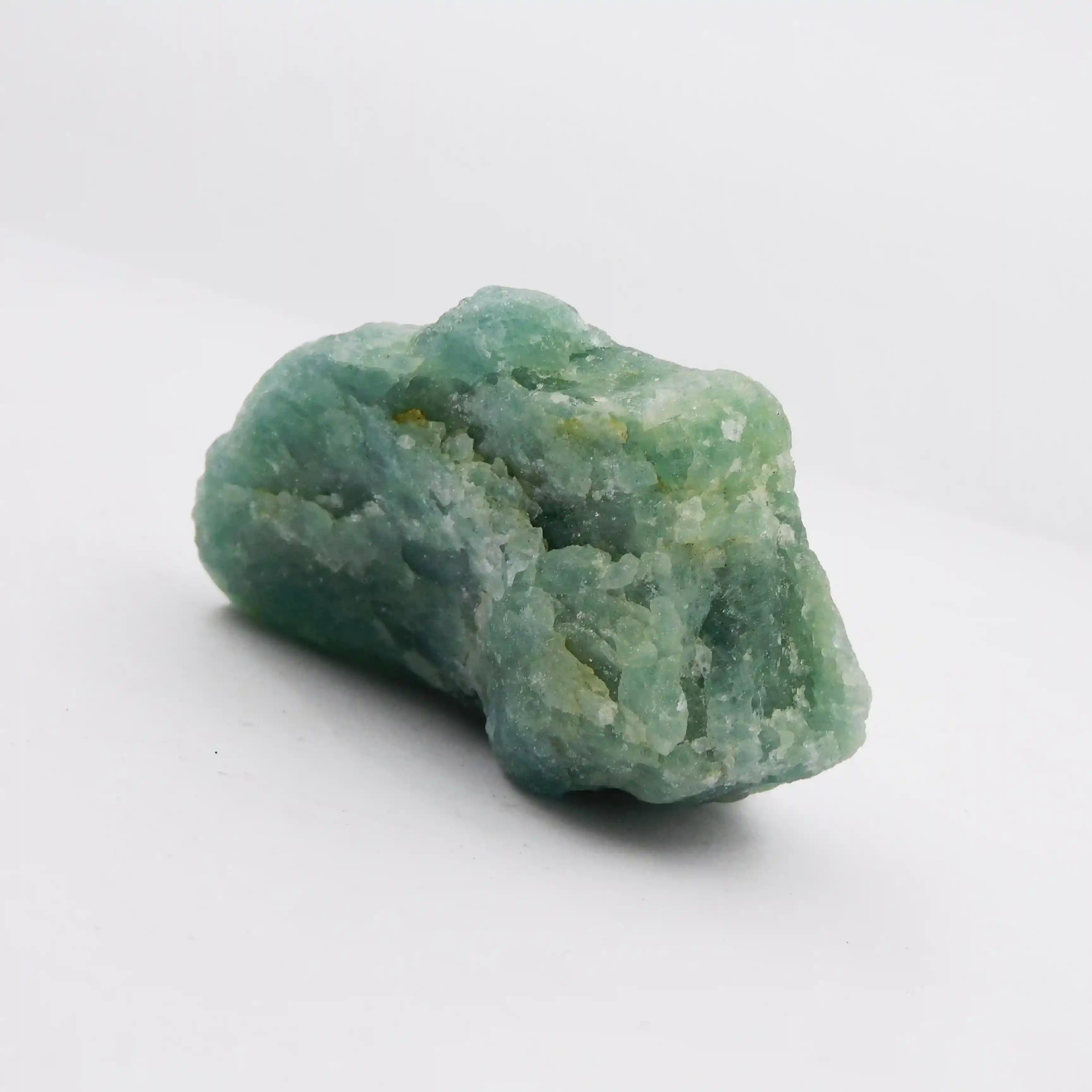 Green crystal rock on a white background