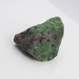 Green and purple mineral stone on a white background