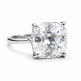 Diamond ring with a cushion-cut gemstone on a white background