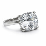 Diamond ring with a large central gemstone on a white background