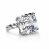 Diamond ring with a large, clear gemstone on a white background