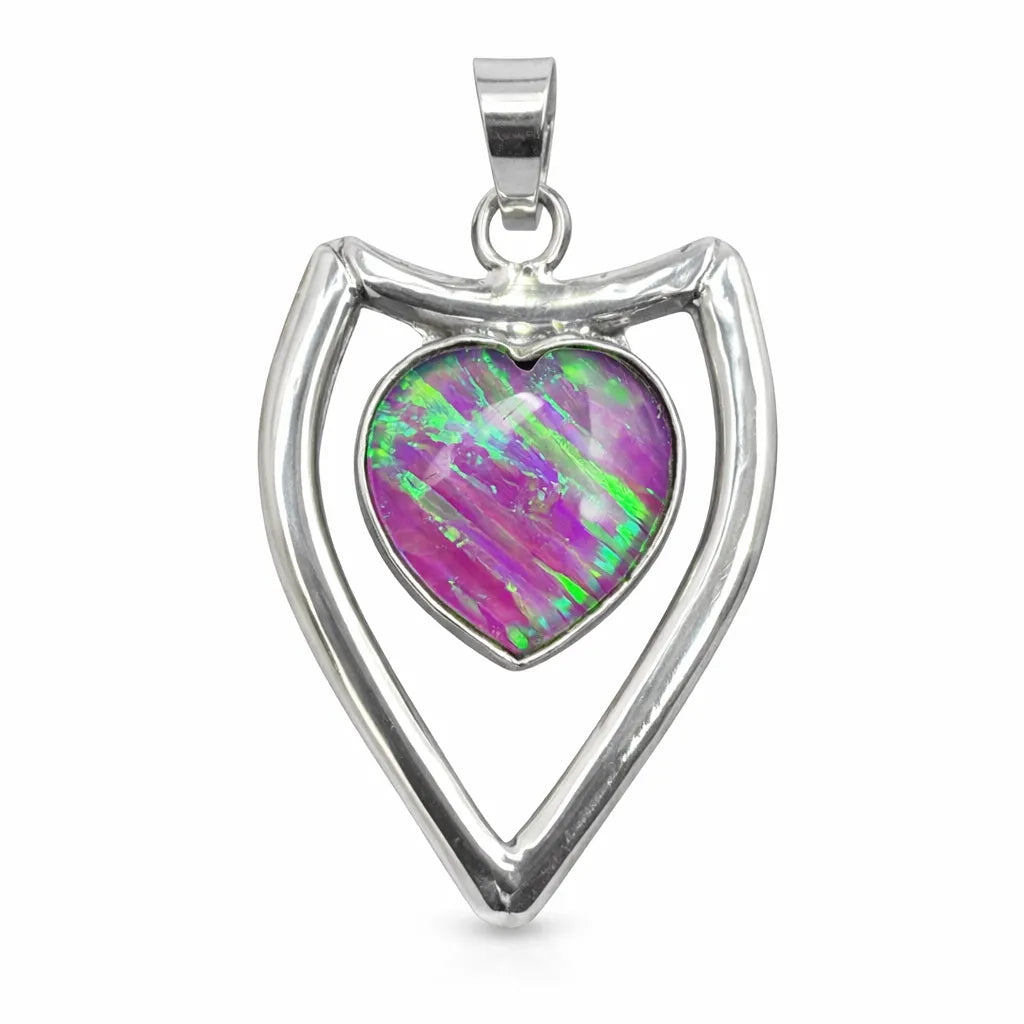Silver pendant with a heart-shaped opal stone on a white background
