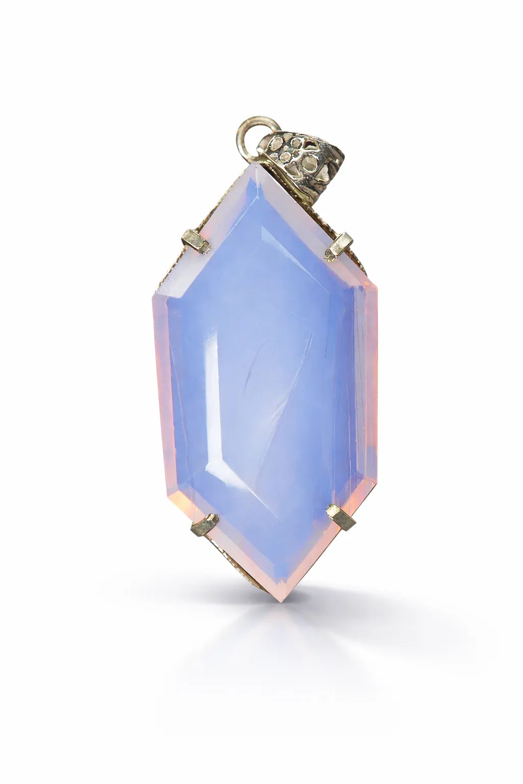 Blue chalcedony pendant with gold setting on a white background