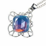 Necklace with a colorful gemstone pendant on a white background