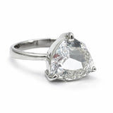 Silver ring with a large clear gemstone on a white background