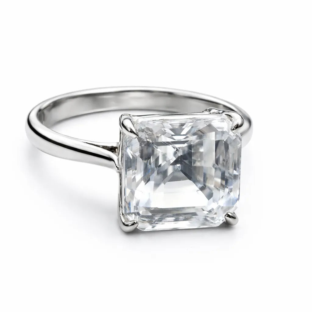 Silver ring with a large square-cut gemstone on a white background
