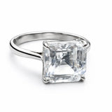 Silver ring with a large square-cut gemstone on a white background