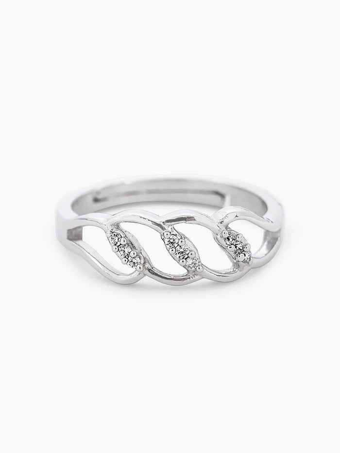 Silver ring with diamond accents on a white background