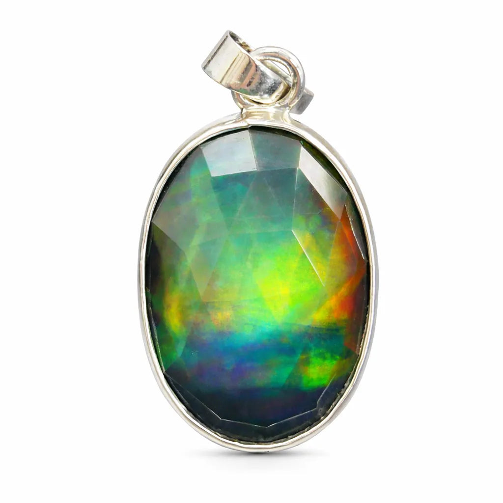 Multicolored gemstone pendant with silver setting on a white background
