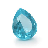 “Close-up of polished blue teardrop gem with reflective facets on dark cloth.”