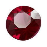 Faceted red gemstone on a white background