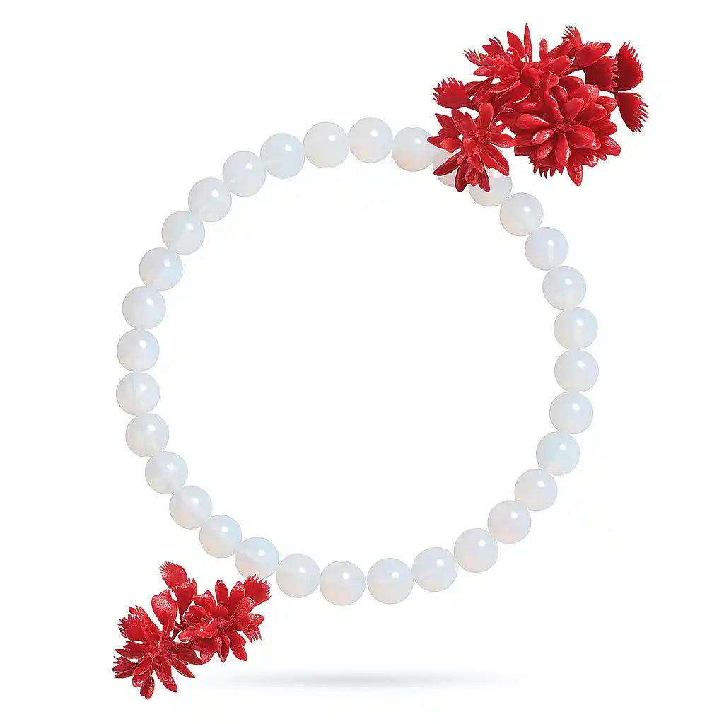 White beaded bracelet with red floral ends on a white background